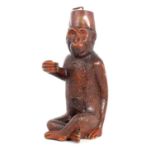 A 19TH CENTURY BLACK FOREST CARVED MONKEY