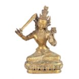 A GILT BRONZE TIBETAN MANJUSHRI SEATED BUDDHA