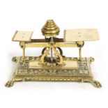 A LATE 19TH CENTURY BRASS POSTAL SCALE