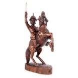 A CHINESE CARVED HARDWOOD FIGURE OF A GENERAL ON HORSE BACK