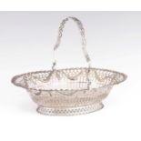 A LARGE GEORGE III PIERCED SWING HANDLE SILVER FRUIT BASKET