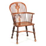 A 19TH CENTURY NOTTINGHAMSHIRE ASH AND FRUITWOOD WINDSOR ARMCHAIR