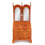 A WILLIAM AND MARY HERRING-BANDED AND FIGURED WALNUT BUREAU BOOKCASE