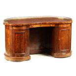 A LATE REGENCY FIGURED ROSEWOOD KIDNEY-SHAPED PEDESTAL DESK IN THE MANNER OF GILLOWS