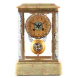 A LATE 19TH CENTURY FRENCH ONYX, BRASS AND CHAMPLEVE ENAMEL MANTEL CLOCK