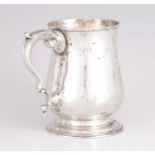 A GEORGE III SILVER TANKARD