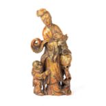 A CHINESE CARVED SOAP STONE FIGURAL STATUE