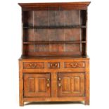AN EARLY 18TH CENTURY JOINED OAK DRESSER AND RACK OF SMALL SIZE initialled ER to the rackled ER