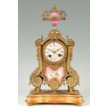 A 19TH CENTURY FRENCH GILT METAL AND PORCELAIN PANELLED MANTEL CLOCK