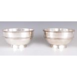 A LARGE PAIR OF LATE 19TH CENTURY CHINESE SILVER BOWLS OF MILITARY INTEREST