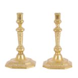 A PAIR OF 18TH CENTURY FRENCH ENGRAVED BRASS CANDLESTICKS