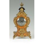 A LATE 19TH CENTURY GERMAN EBONISED AND WALNUT FRONTED ORNATE GILT METAL MOUNTED MANTEL CLOCK IN THE