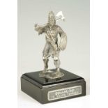 A CAST SILVER FIGURE OF A KNIGHT