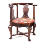AN UNUSUAL GEORGE I WALNUT CORNER CHAIR WITH A ROUNDED FRAME