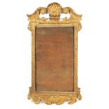 A GEORGE II GILT GESSO CARVED HANGING MIRROR FRAME