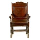 AN EARLY 18TH CENTURY WELSH OAK WAINSCOT CHAIR