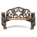 A 19TH CENTURY BLACK FOREST CARVED TWO SEATER HALL BENCH