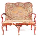 A QUEEN ANNE STYLE SCARLET LACQUER AND CHINOISERIE DECORATED TWO SEATER SETTEE