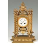 A 19TH CENTURY FRENCH SILVERED AND GILT METAL MANTEL CLOCK
