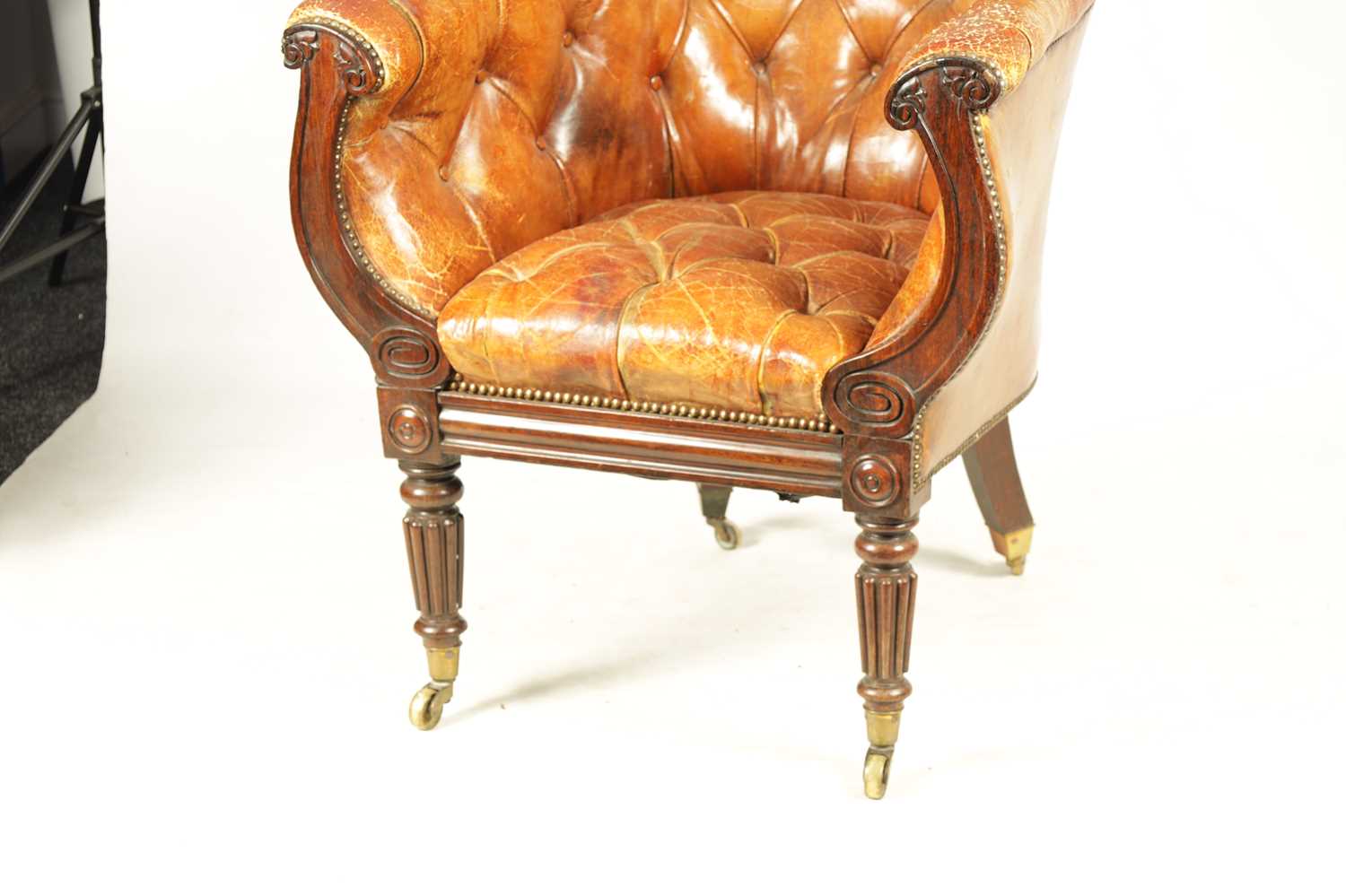 A LATE REGENCY ROSEWOOD FRAMED AND STUDDED TAN LEATHER UPHOLSTERED LIBRARY CHAIR - Image 2 of 6