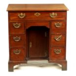 A GEORGE III MAHOGANY KNEEHOLE DESK