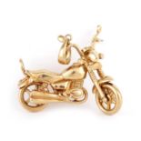 A VINTAGE 9CT GOLD MOTORCYCLE PENDANT