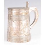 A GEORGE III SILVER LIDDED TANKARD