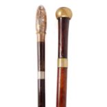 TWO LATE 19TH CENTURY BRASS BOUND SWORD STICKS