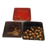 A GROUP OF THREE LATE 19TH CENTURY JAPANESE COLOURED LACQUERWORK SQUARE TRAYS