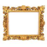 A 19TH CENTURY CARVED GILT GESSO FLORENTINE FRAME