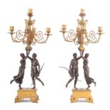 A PAIR OF 19TH CENTURY ORMOLU AND PATINATED BRONZE FIGURAL CANDELABRA