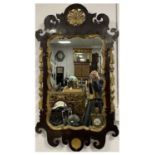 AN EARLY 18TH CENTURY MAHOGANY AND GILT CARVED HANGING MIRROR