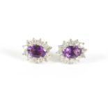 A PAIR OF LADIES 9CT GOLD AMETHYST AND DIAMOND EARINGS