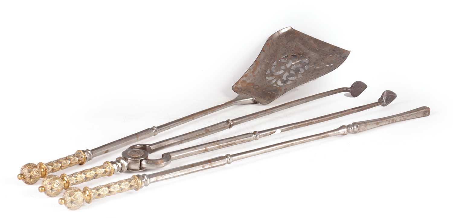 A SET OF THREE REGENCY BRONZE AND POLISHED STEEL FIRE IRONS