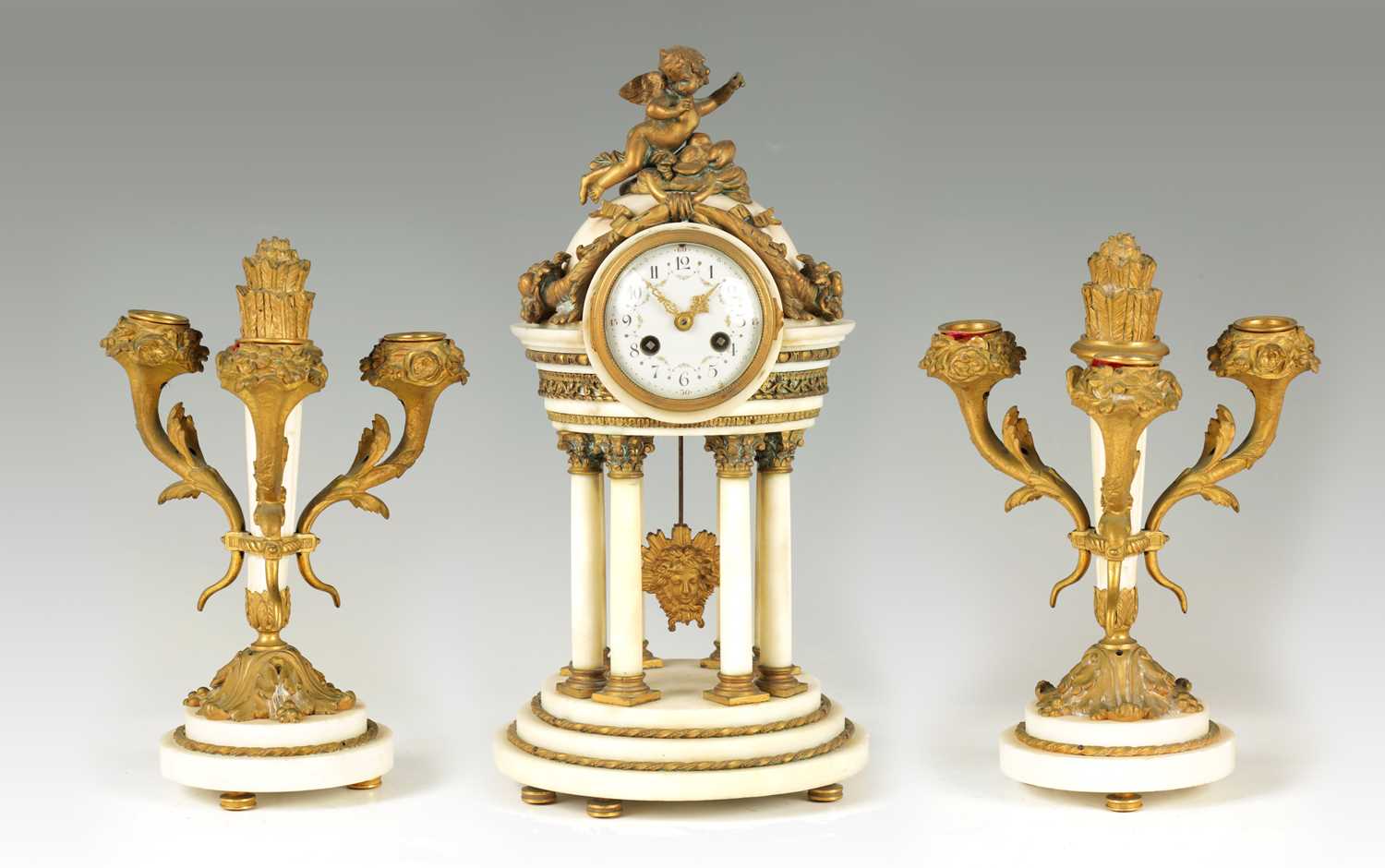 A 19TH CENTURY FRENCH THREE PIECE CLOCK GARNITURE
