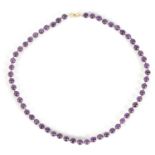 A LADIES 14CT GOLD AMETHYST BEADED NECKLACE