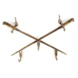 A NOVELTY COAT HOOK MADE FROM TWO 19TH CENTURY BAYONETS