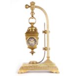 AN UNUSUAL LATE 19TH CENTURY FRENCH BRASS AND ONYX NOVELTY MANTEL CLOCK