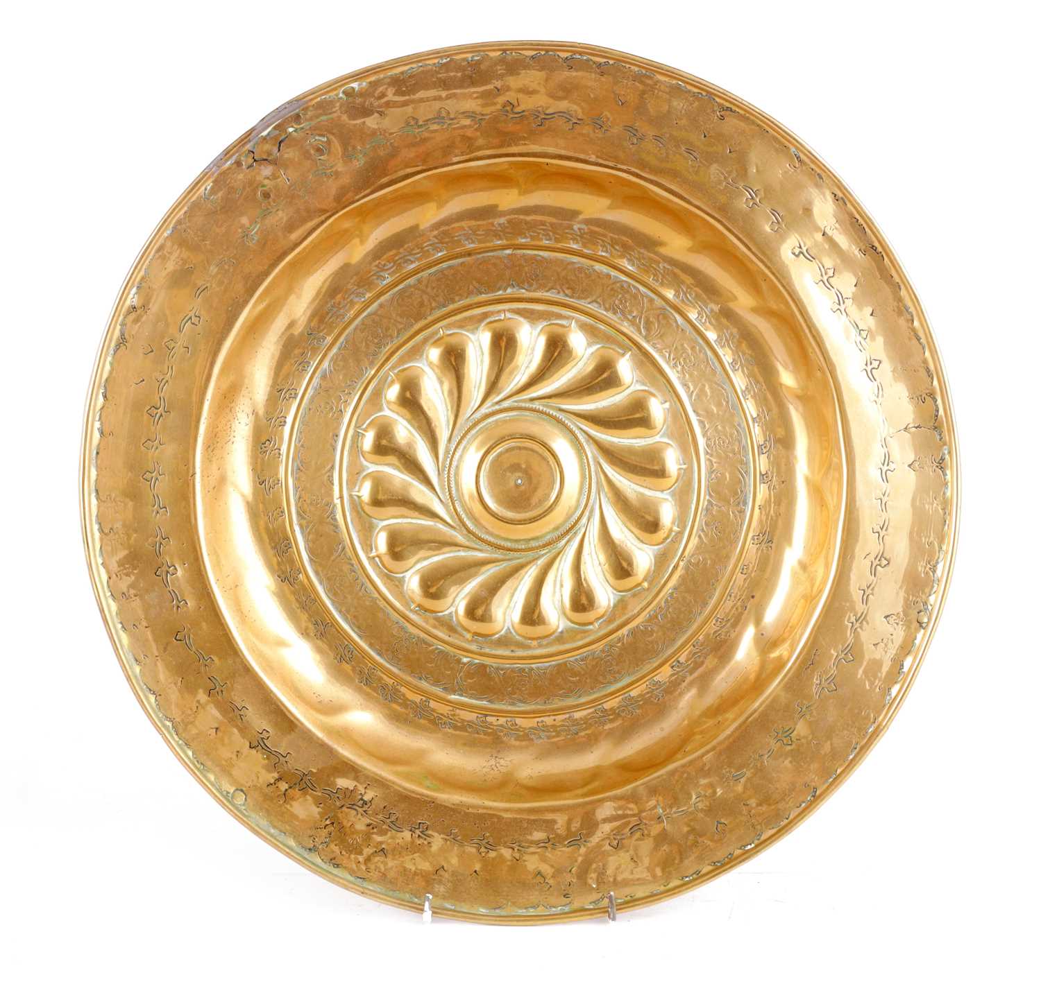 A 16TH CENTURY NUREMBERG BRASS ALMS DISH