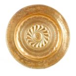 A 16TH CENTURY NUREMBERG BRASS ALMS DISH