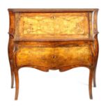 AN EARLY 18TH CENTURY CONTINENTAL SERPENTINE INLAID WALNUT BUREAU OF GOOD COLOUR AND PATINA