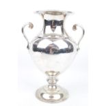 A Heavy Silver Campana-shaped vase with two loop handles, 17cm high, London 1906 by Charles Stuart