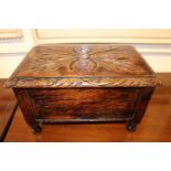 Oak Carved box with hinged lid, supported on turned feet, 38cm in Width