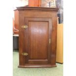 Late Georgian Oak panelled corner cabinet with fitted interior, 102cm in Height