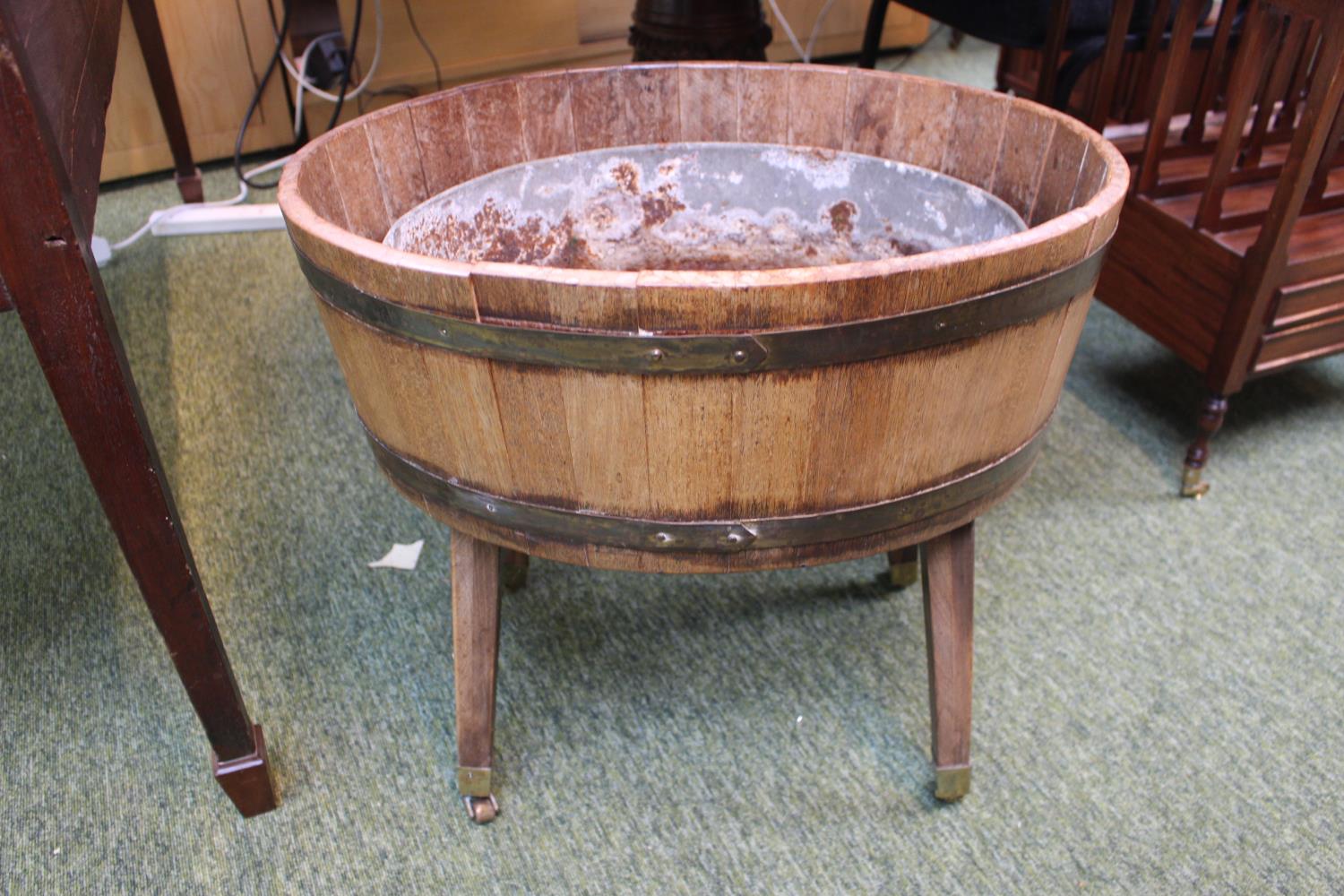 19thC Heavy construction Oak brass bound planter on splayed legs terminating on brass casters