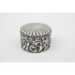 Victorian Circular Silver Jewel box with embossed decoration, hinged lid and gilded interior by