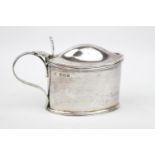 An oval Silver Georgian-style mustard pot with reeded rims, Sheffield 1911. 97g total weight without