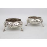 A Pair of Silver Victorian embossed salts on pad feet, 8cm London 1851 by William Robert Smily, 114g