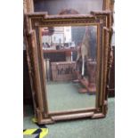 Late 19thC Gilt Gesso framed mirror with bed and line decoration and foliate banding, bevel edge.