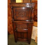 Late Victorian Oak carved hall court cabinet with panel friezes and turned supports. 66cm in Width